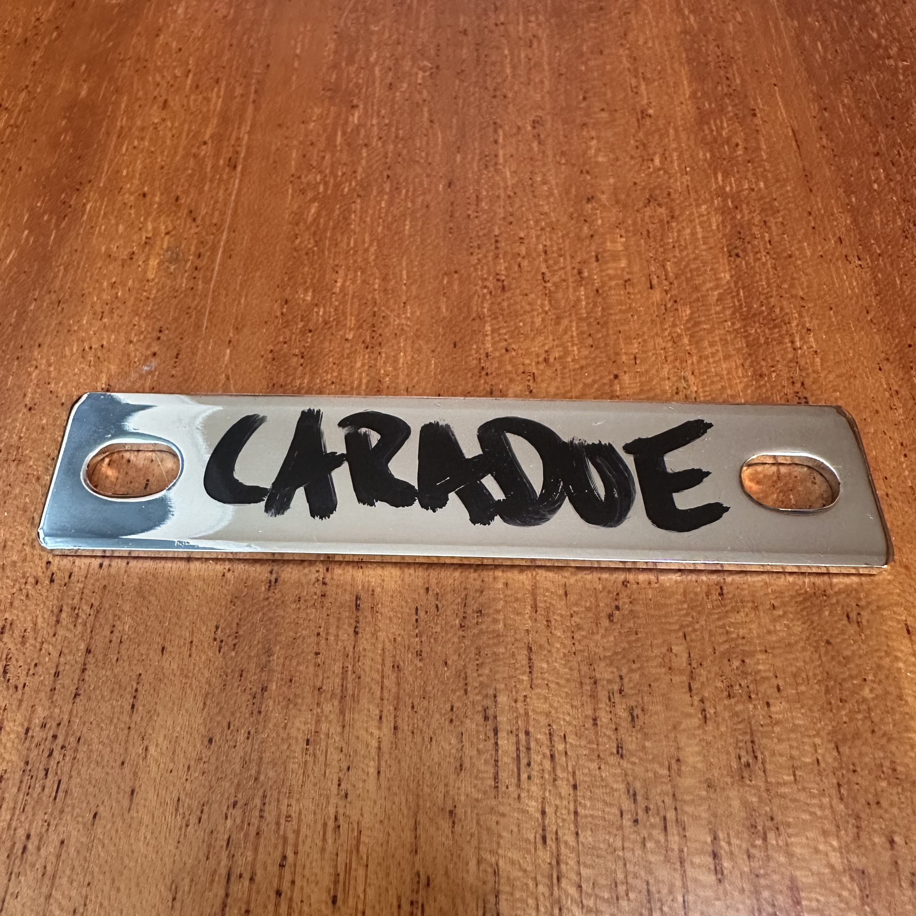 The metal ingot bearing the name Caradue, written in water-soluble ink