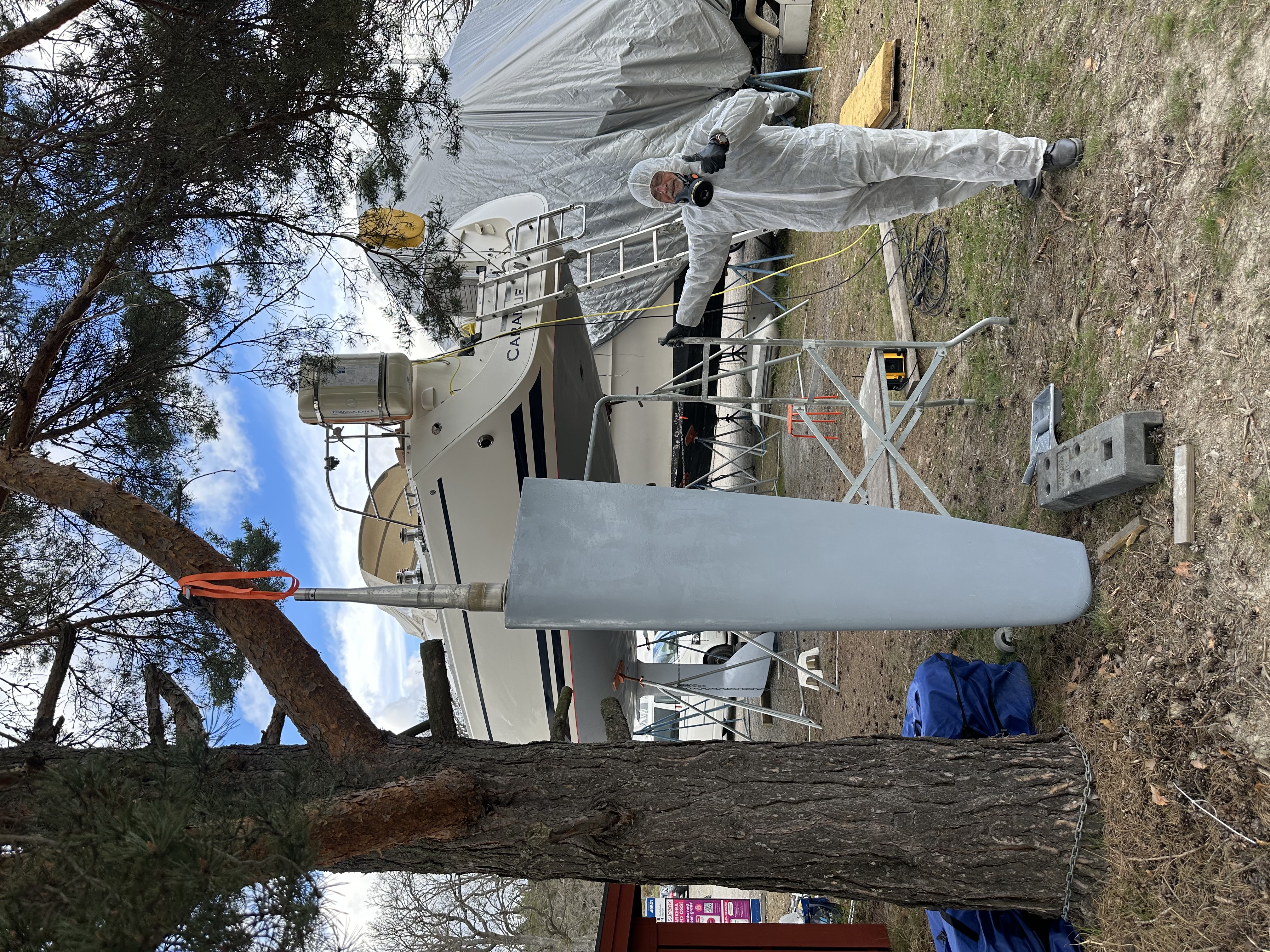 Arne next to the freshly primed rudder, ready to go back on