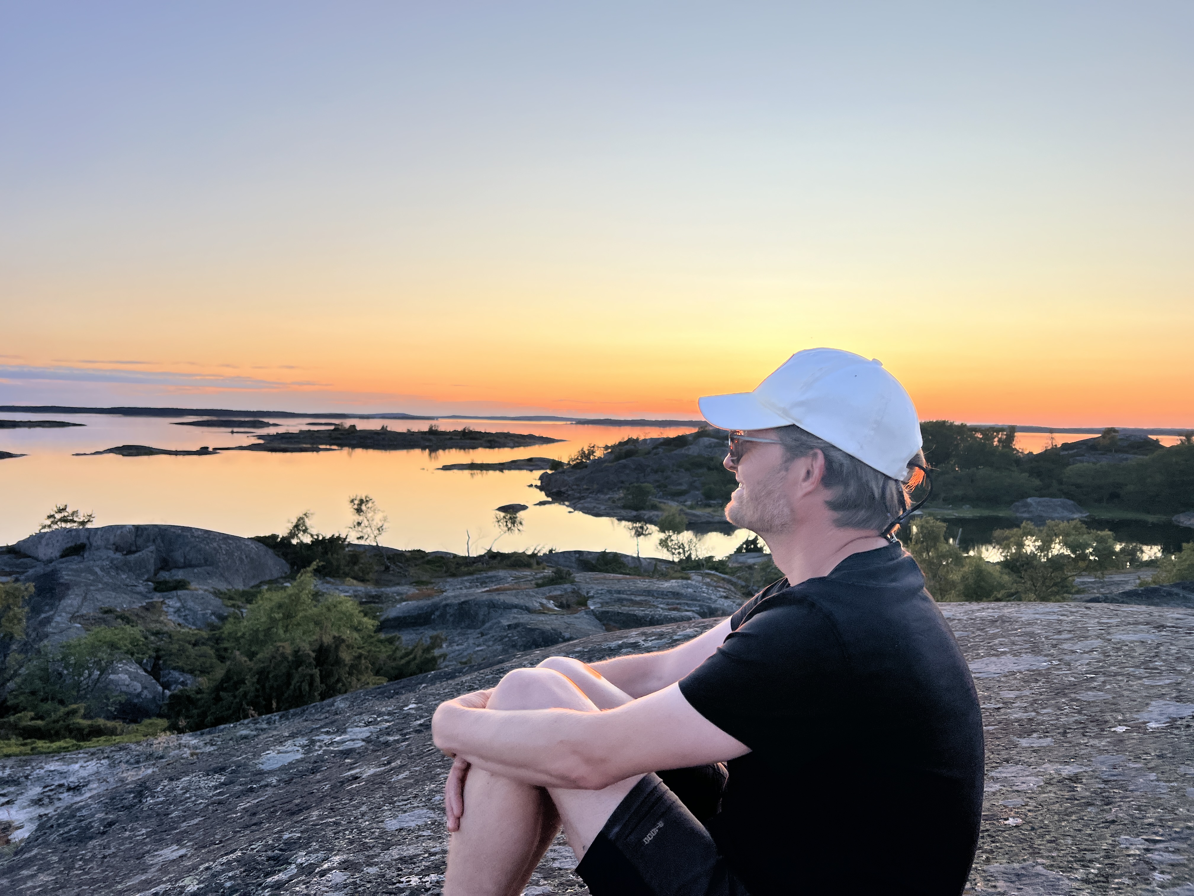 Watching the midsummer sunset from the hilltop at Finnskär